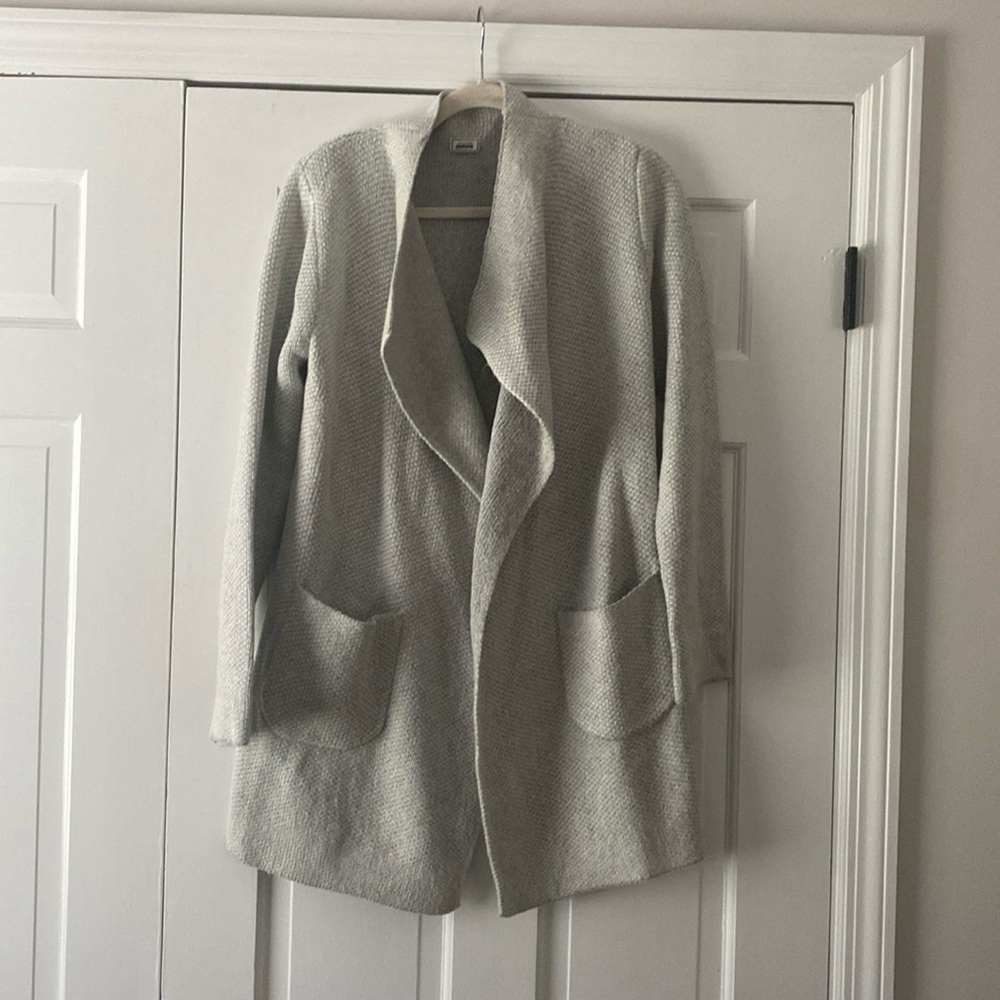 Light gray sweater pockets